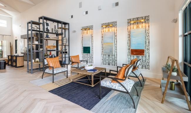 a clubroom with a coffee table and chairs