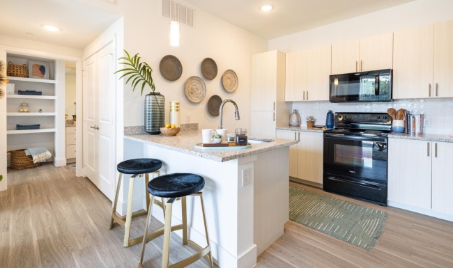 a kitchen with white cabinets