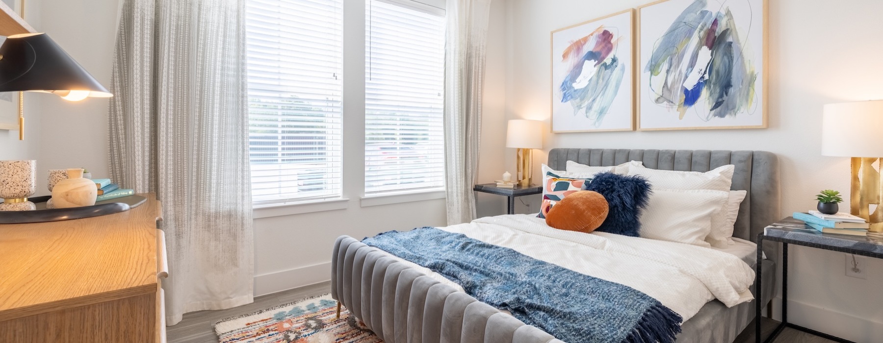 a bedroom with a bed and a fan