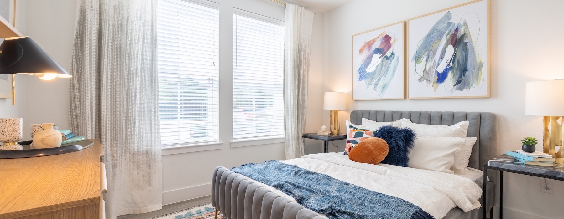 a bedroom with a bed and a fan
