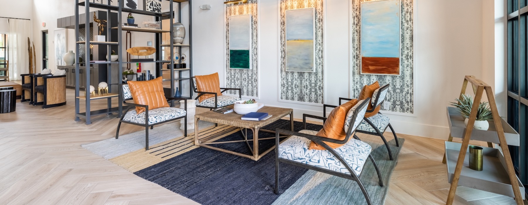 a clubroom with a coffee table and chairs