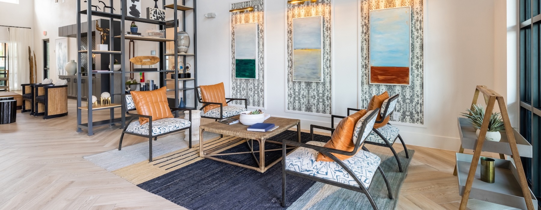 a clubroom with a coffee table and chairs