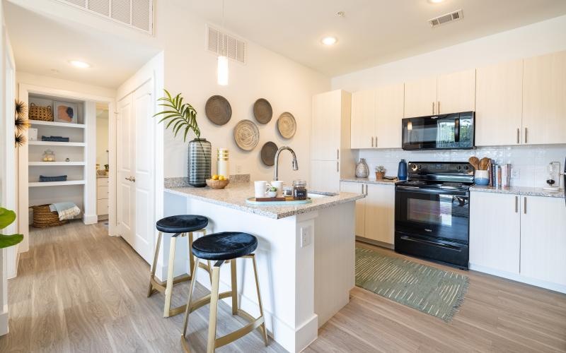 a kitchen with white cabinets