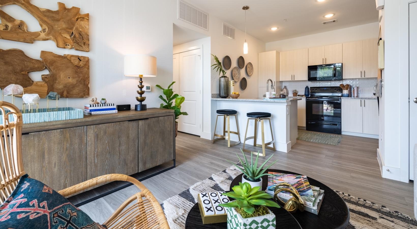 a living room with a coffee table and chairs